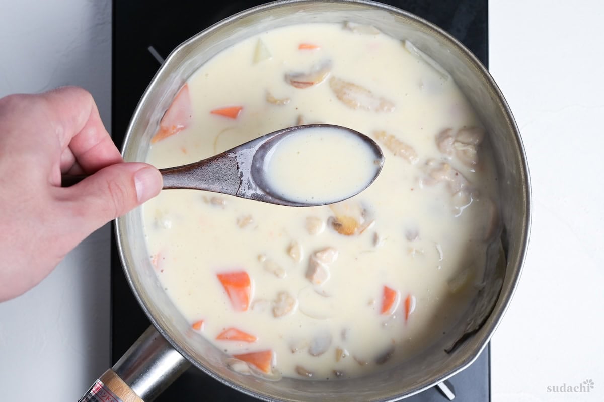 thickened Japanese chicken cream stew in a pot on the stove top