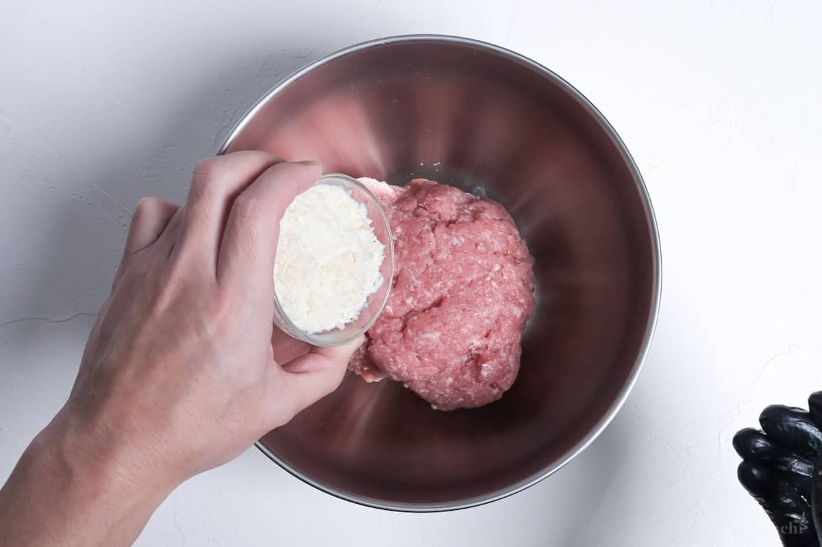 adding panko breadcrumbs to ground pork to make teriyaki meatballs