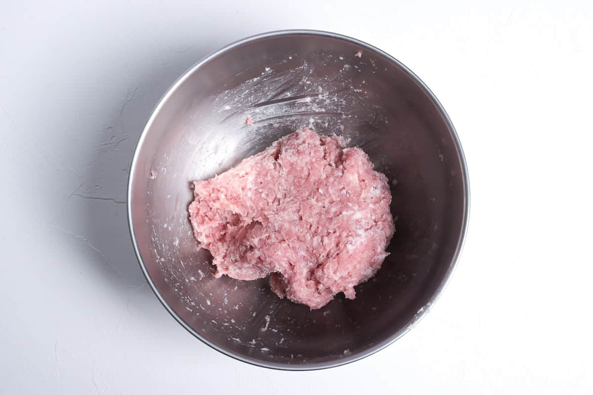 kneaded ground pork and panko to make teriyaki meatballs