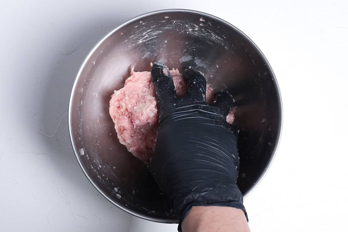 kneading teriyaki meatball mixture