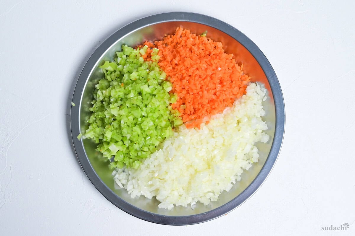 finely diced celery, carrot and onion (Battuto) on a steel plate to make Soffritto