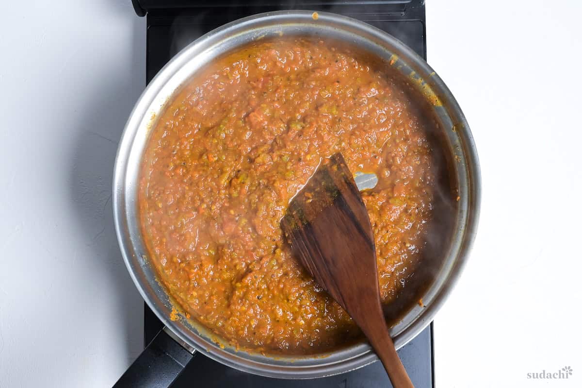 Japanese soup curry base in a stainless steel pan on the stove top