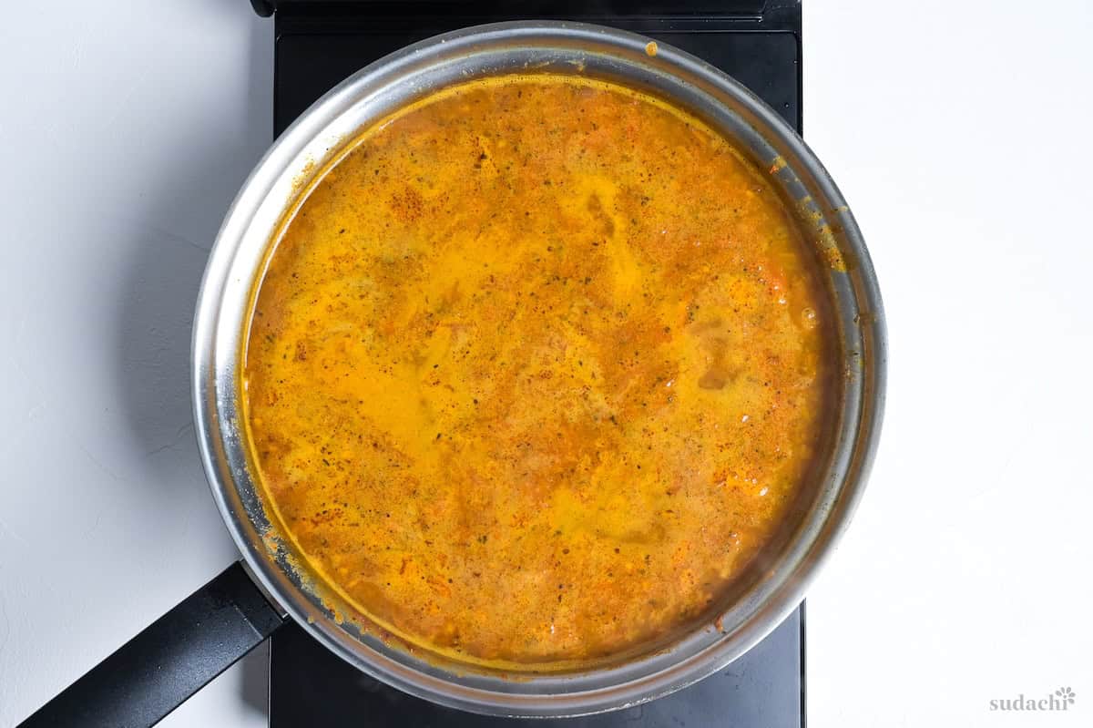 Japanese soup curry simmering in a pan on the stove top