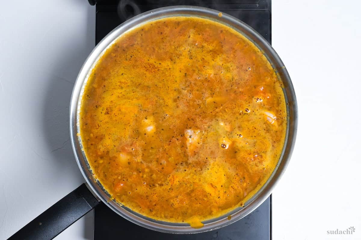 Japanese soup curry simmering in a pan on the stove top