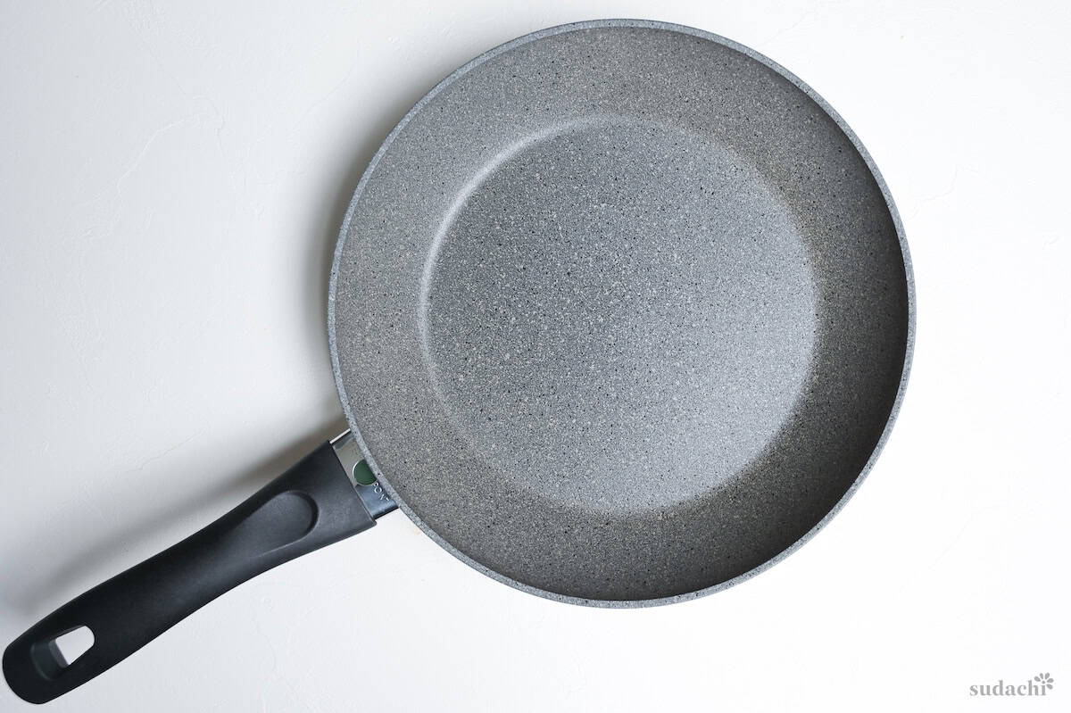 A 26cm non-stick frying pan on a white background