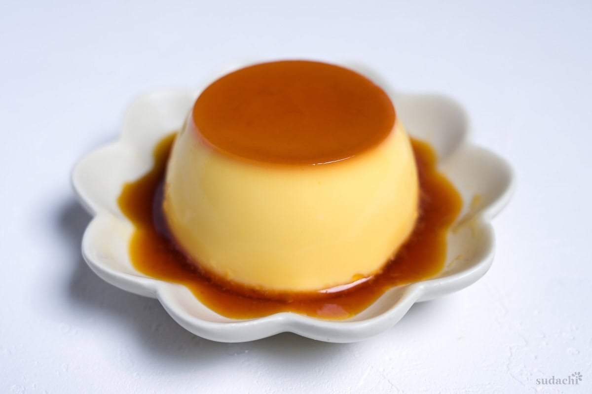Japanese oven baked purin turned out onto a flower shaped plate