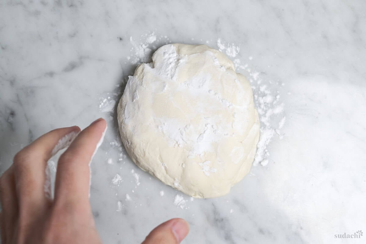 gyoza skin dough dusted with starch before rolling