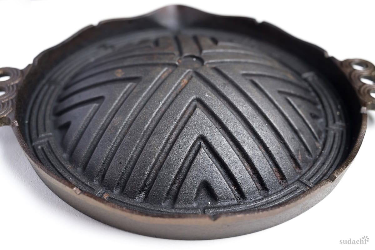 Grill for Jingisukan on a white background side view