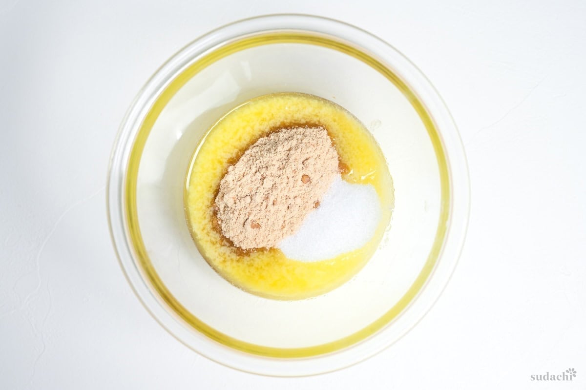 sugar and melted butter in a glass bowl