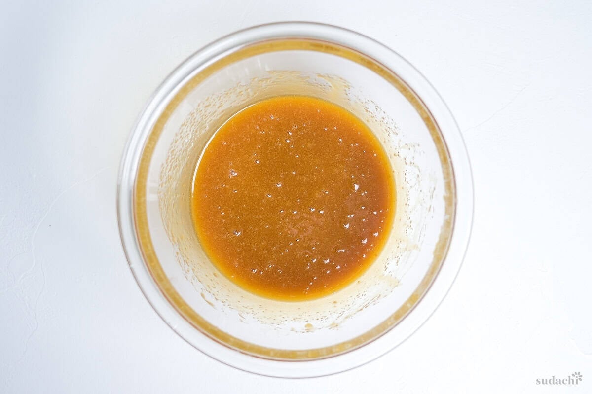 eggs, melted butter and sugar whisked together in a glass mixing bowl.