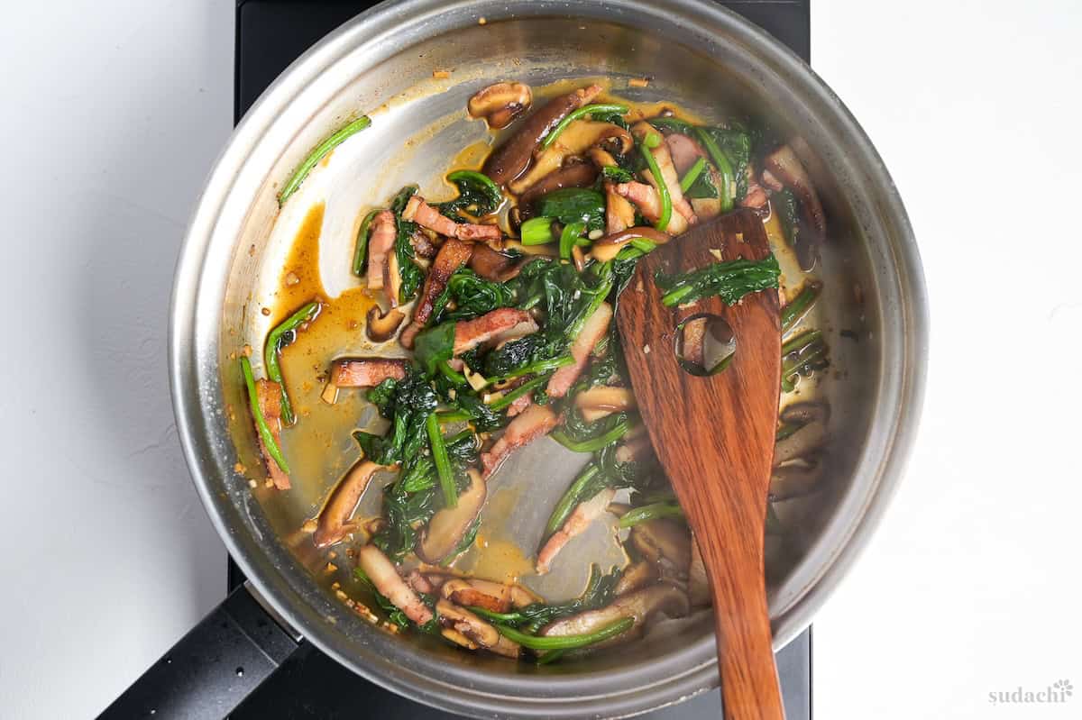 Flavored bacon and vegetables in a pan for wafu pasta base