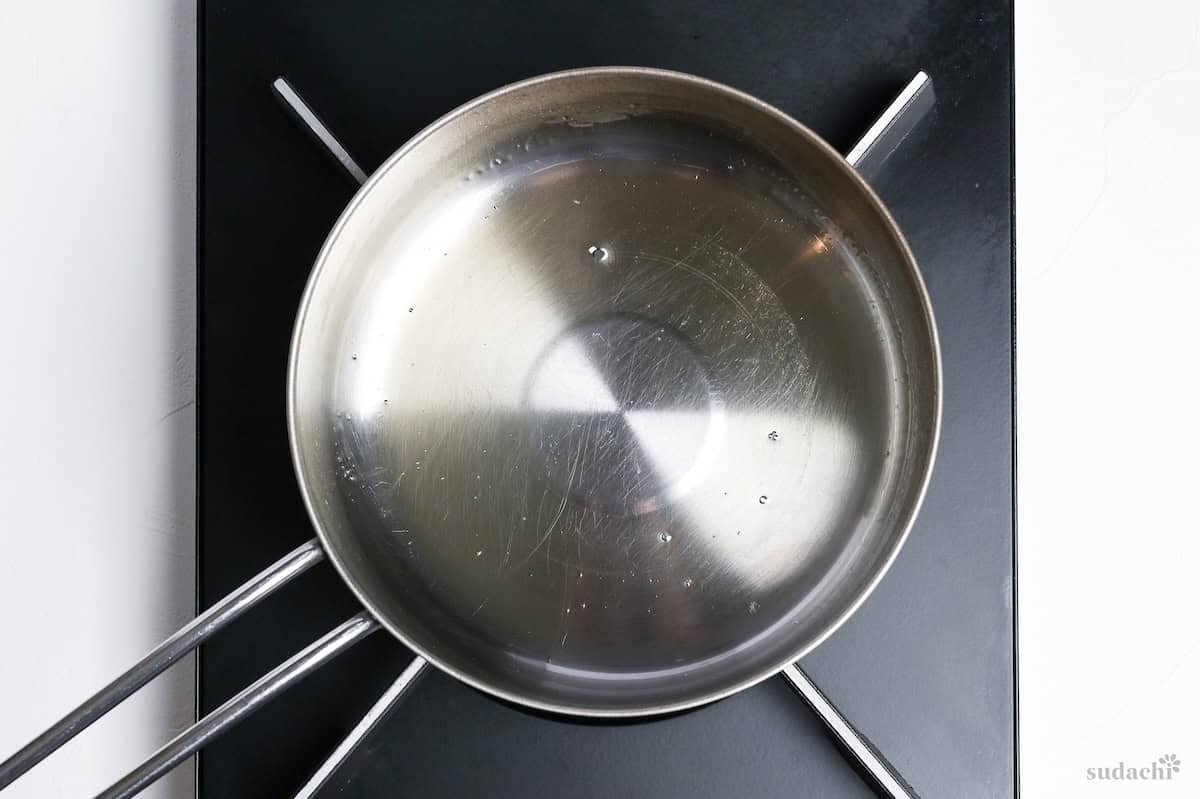 melting sugar in a small pot on the stove top