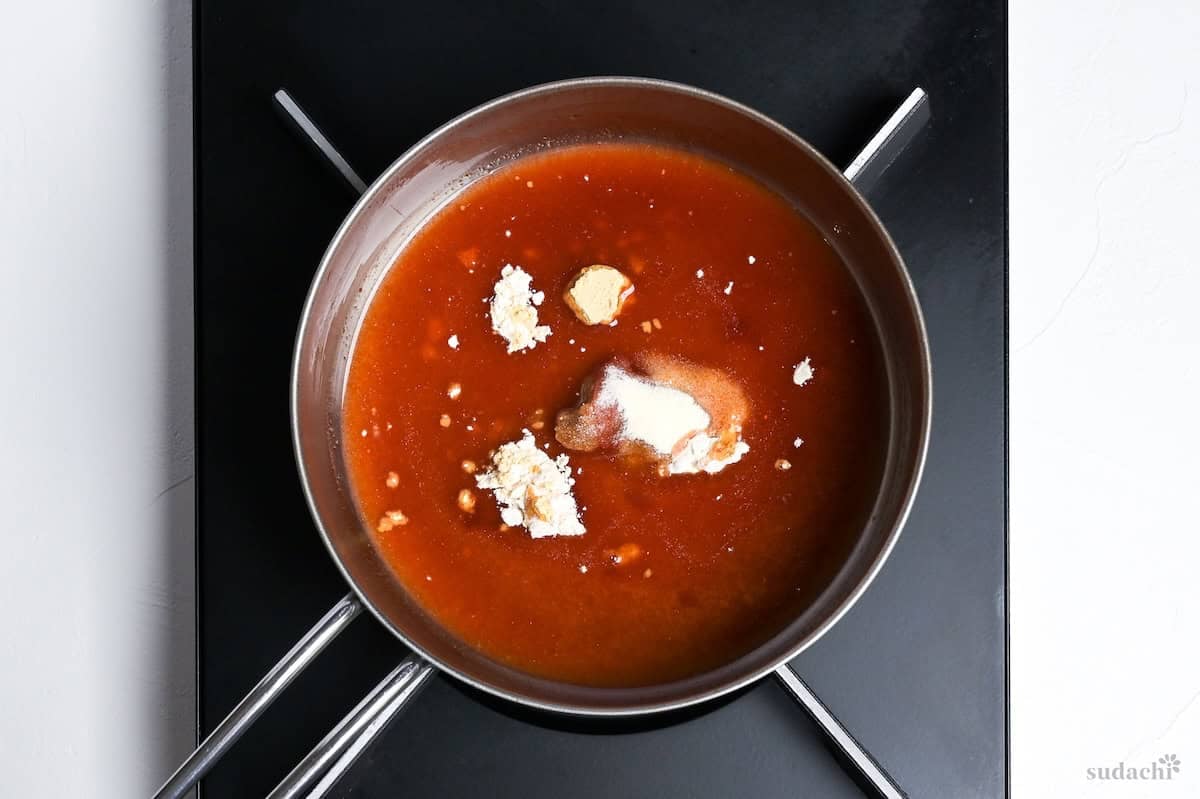 combining ingredients in a saucepan to make yakiniku sauce