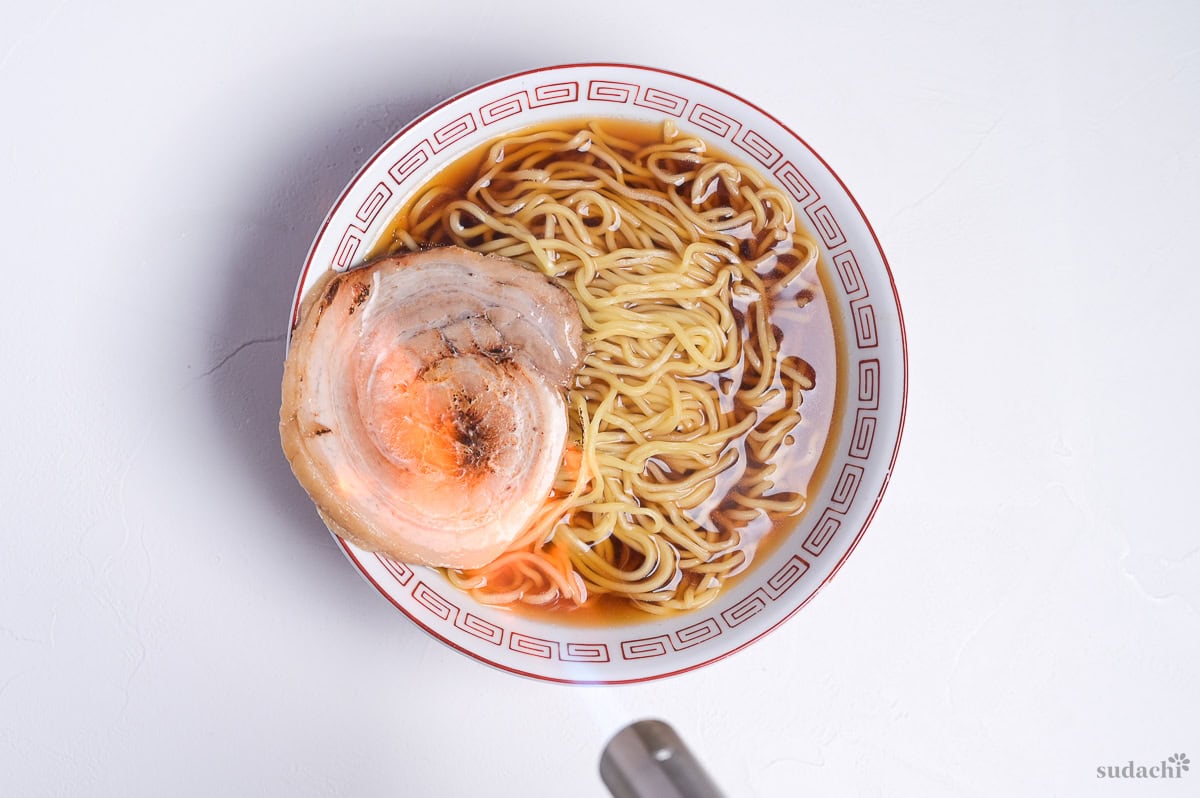 charring pork chashu with a kitchen blowtorch