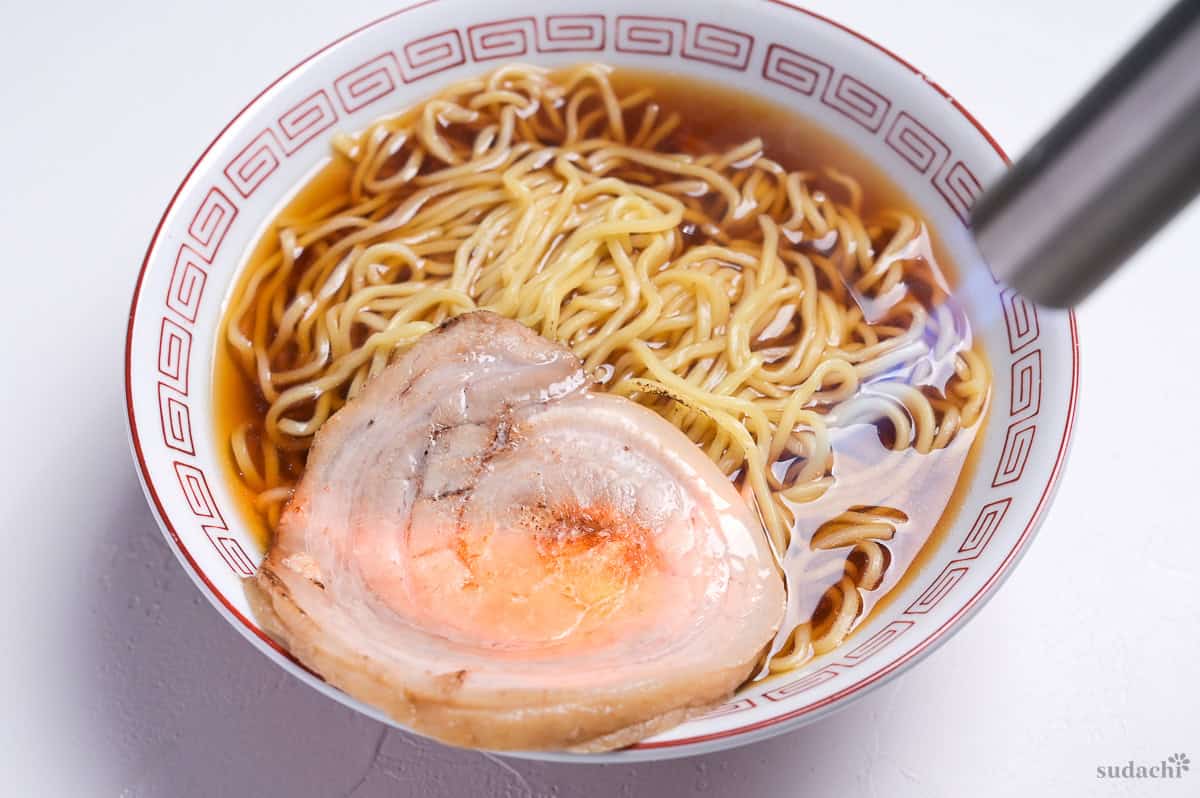 charring pork chashu with a kitchen blowtorch