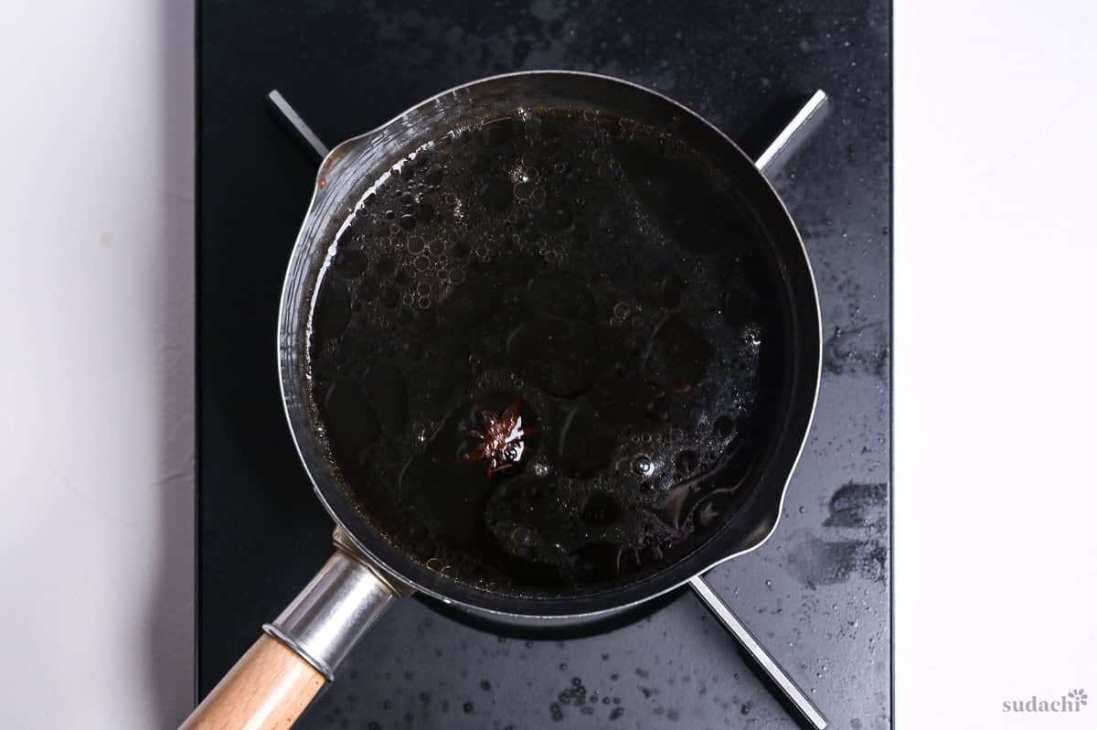 chashu marinade simmering in a pot on the stove