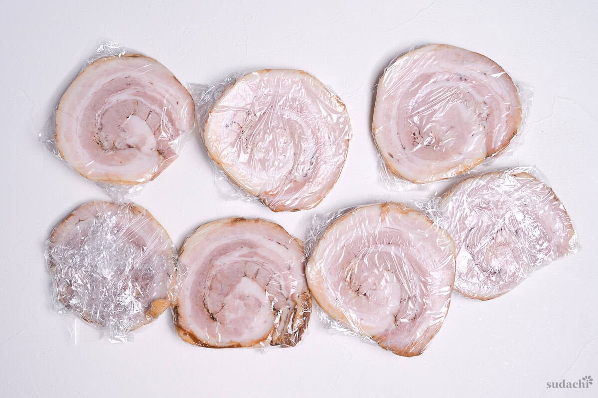 homemade chashu cut into slices and individually wrapped ready for storage
