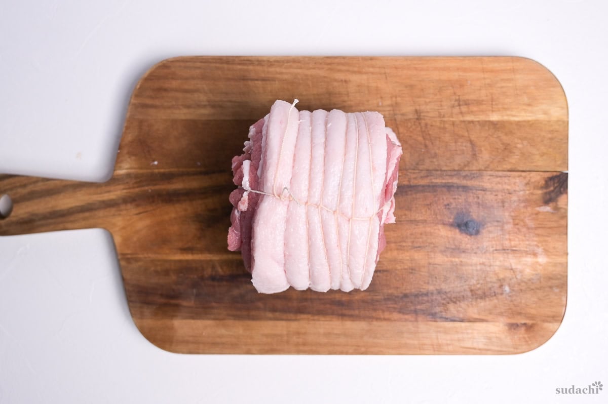 Rolled pork belly wrapped with butchers twine to make chashu