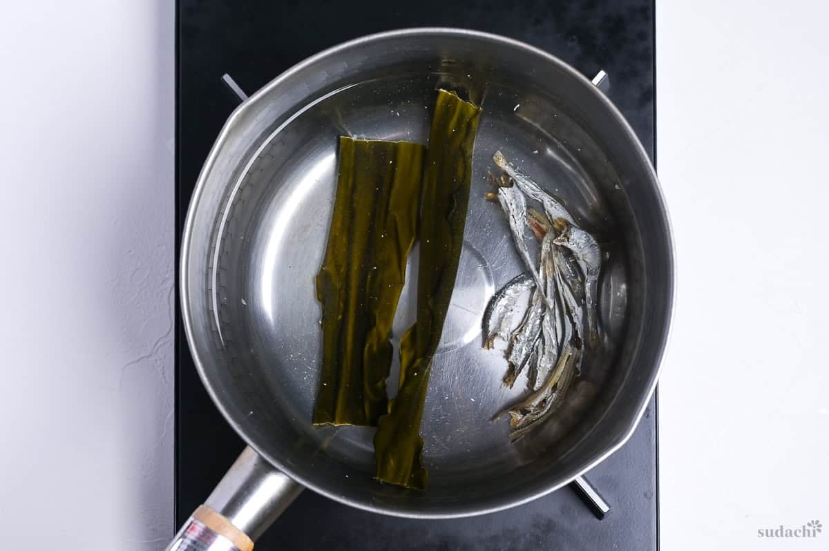kombu and niboshi in a pot of water to make dashi base for shoyu ramen