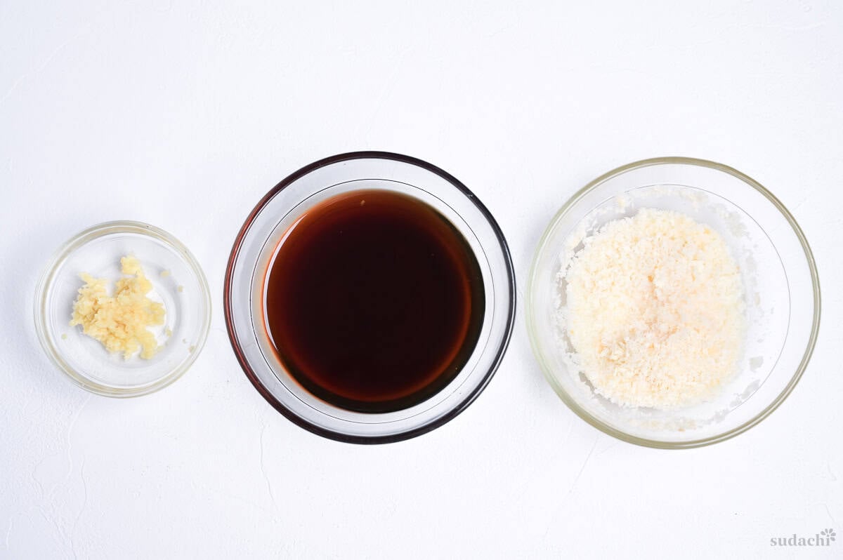 grated ginger, teriyaki sauce and a panade made with panko breadcrumbs and sake in three glass bowls
