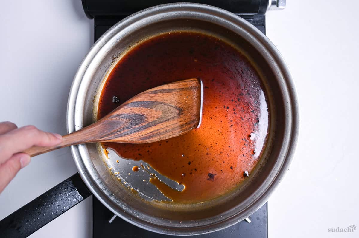 deglazing the frying pan using teriyaki sauce