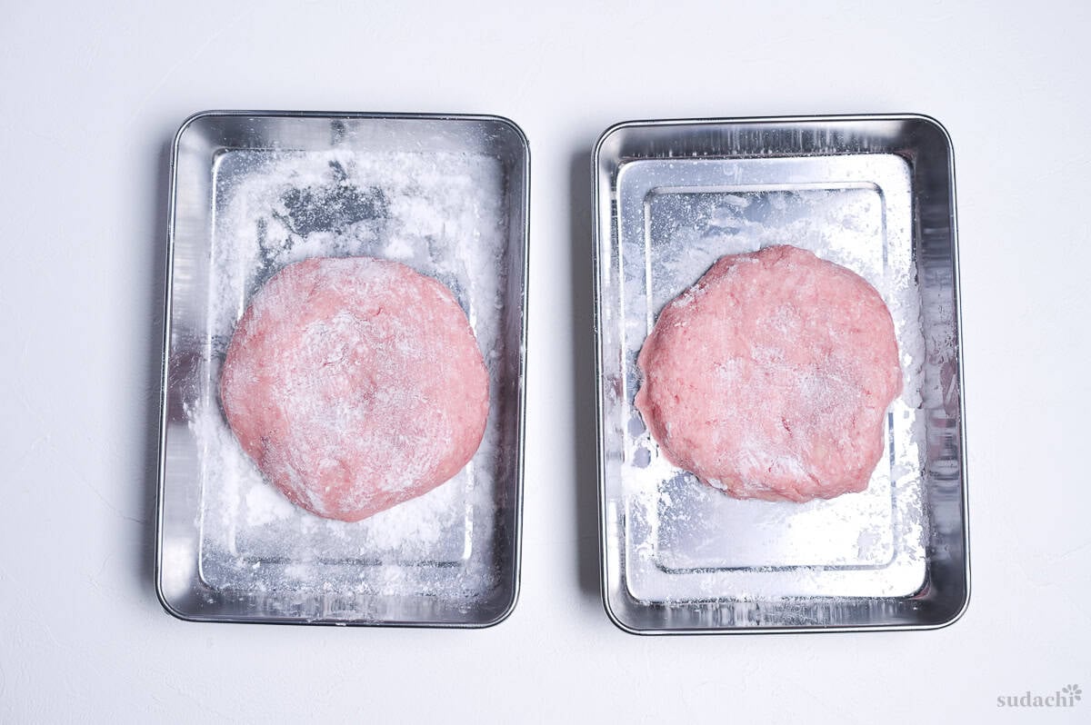 ground pork patties coated with potato starch in separate steel containers