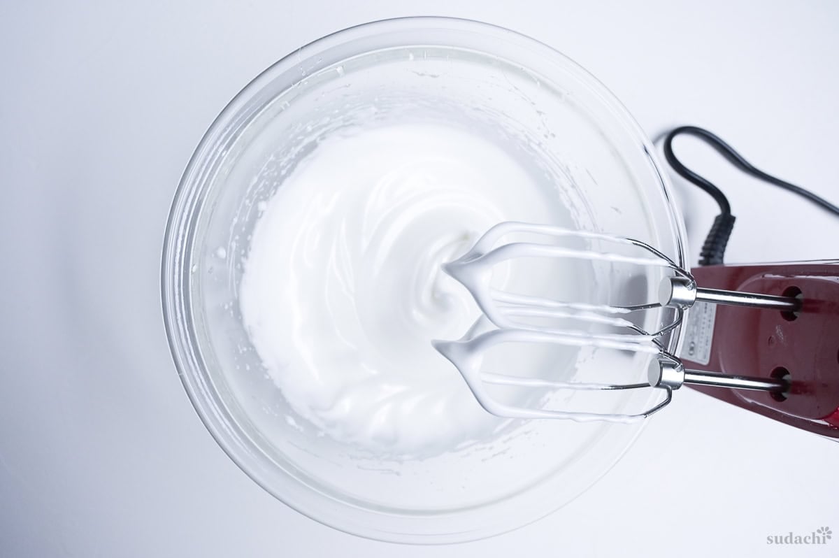 meringue whipped to soft peaks in a glass bowl to make Japanese soufflé cheesecake