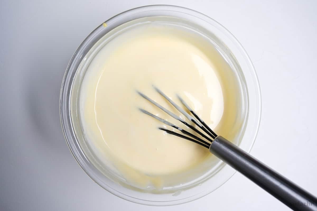 soufflé cheesecake batter in a glass bowl