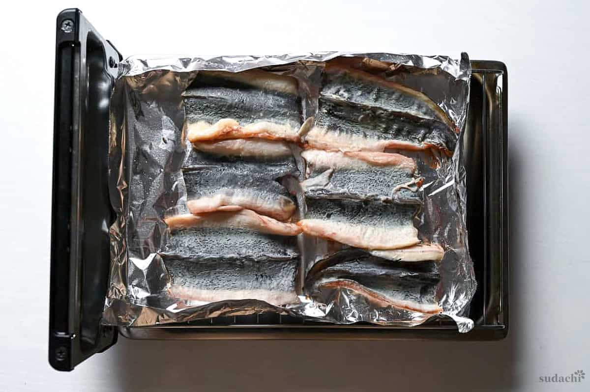 unagi with the skin side facing up on a Japanese fish grill