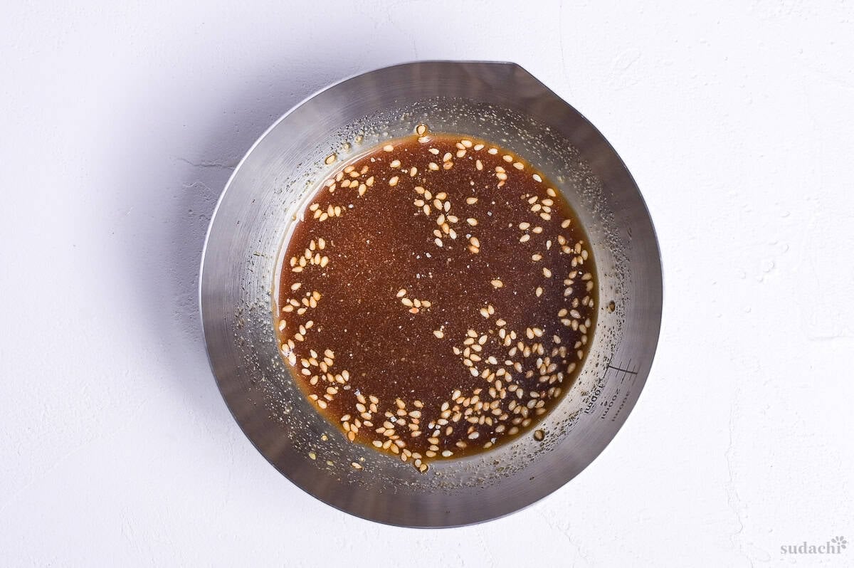 harusame salad dressing in a steel mixing bowl with spouted edge.