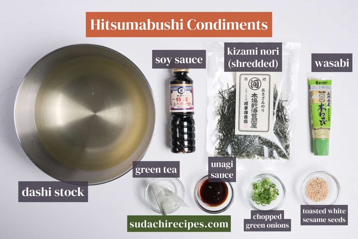 Condiments you can use with hitsumabushi. From top to bottom, left to right: soy sauce, kizami nori, wasabi, dashi stock, green tea, unagi sauce, chopped green onions, toasted white sesame seeds.