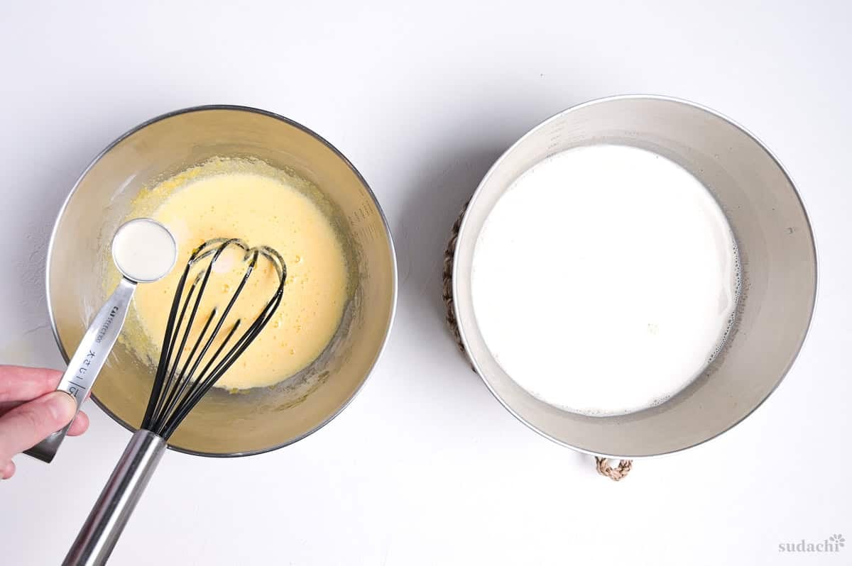 Tempering egg yolk mixture with hot hojicha infused milk and cream