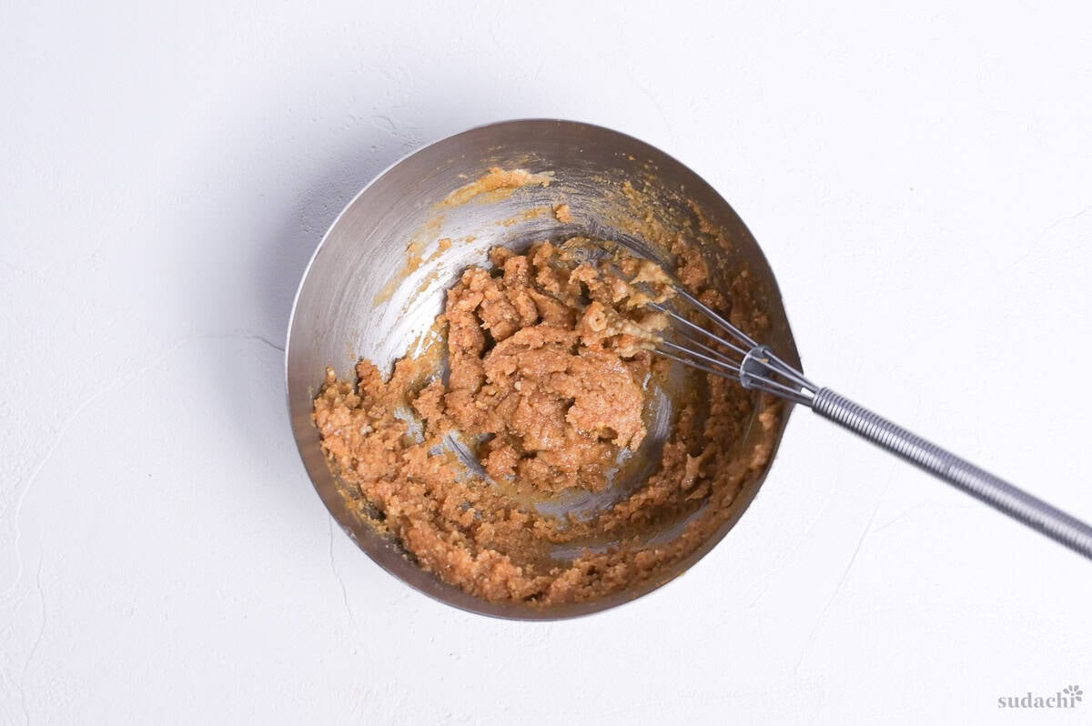 miso paste and nerigoma (sesame paste) whisked together with condiments in a bowl