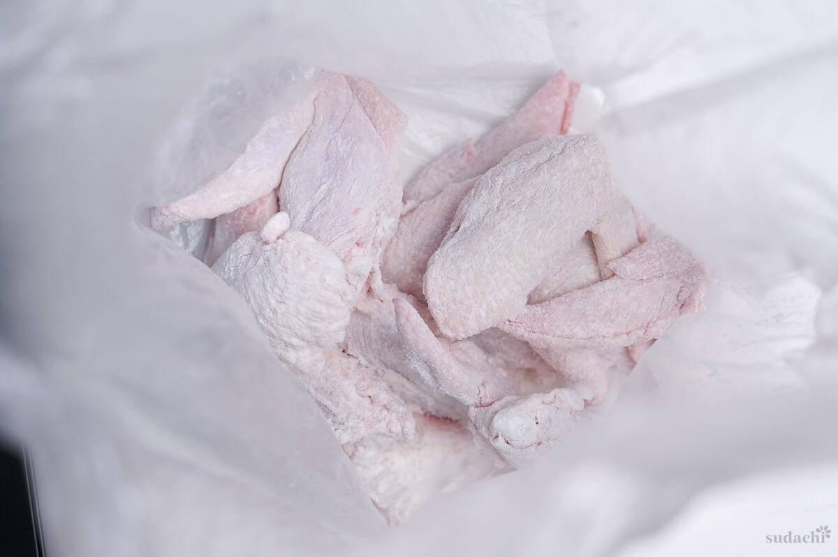Whole chicken wings coated with cornstarch and all purpose flour