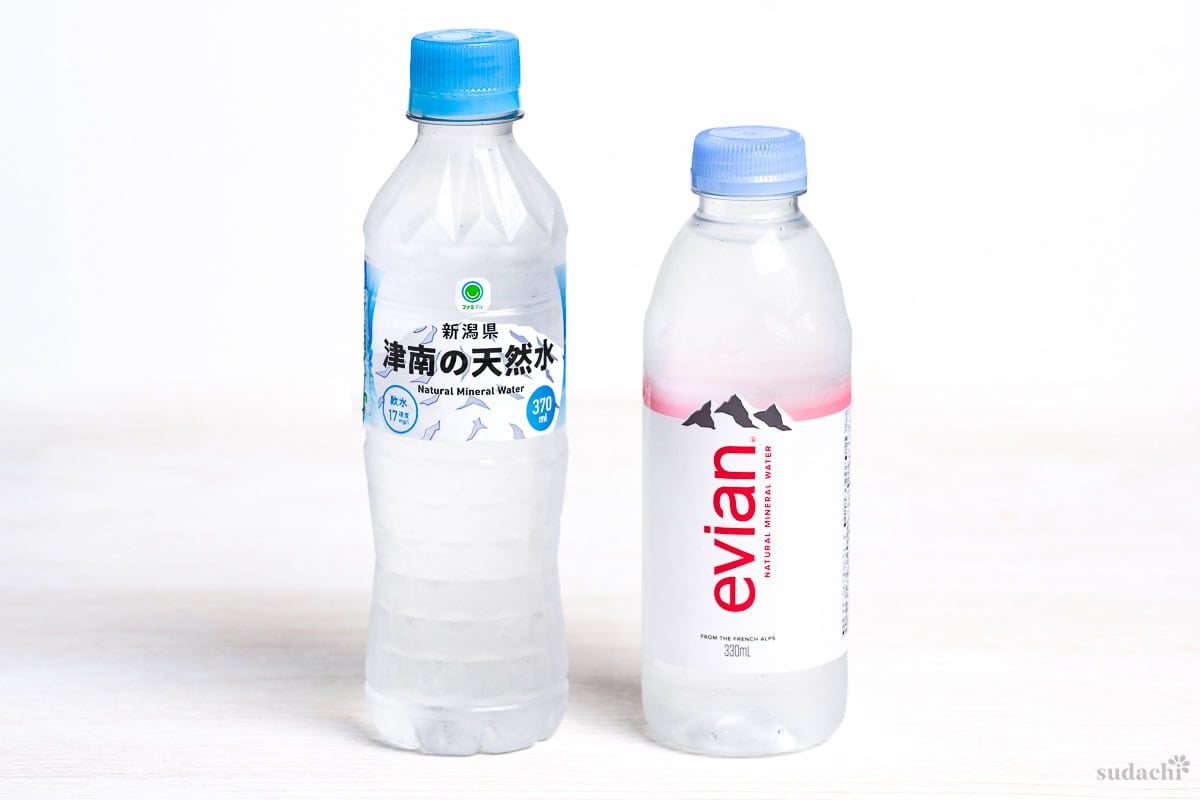 Family mart soft bottled water and evian hard water on a white background