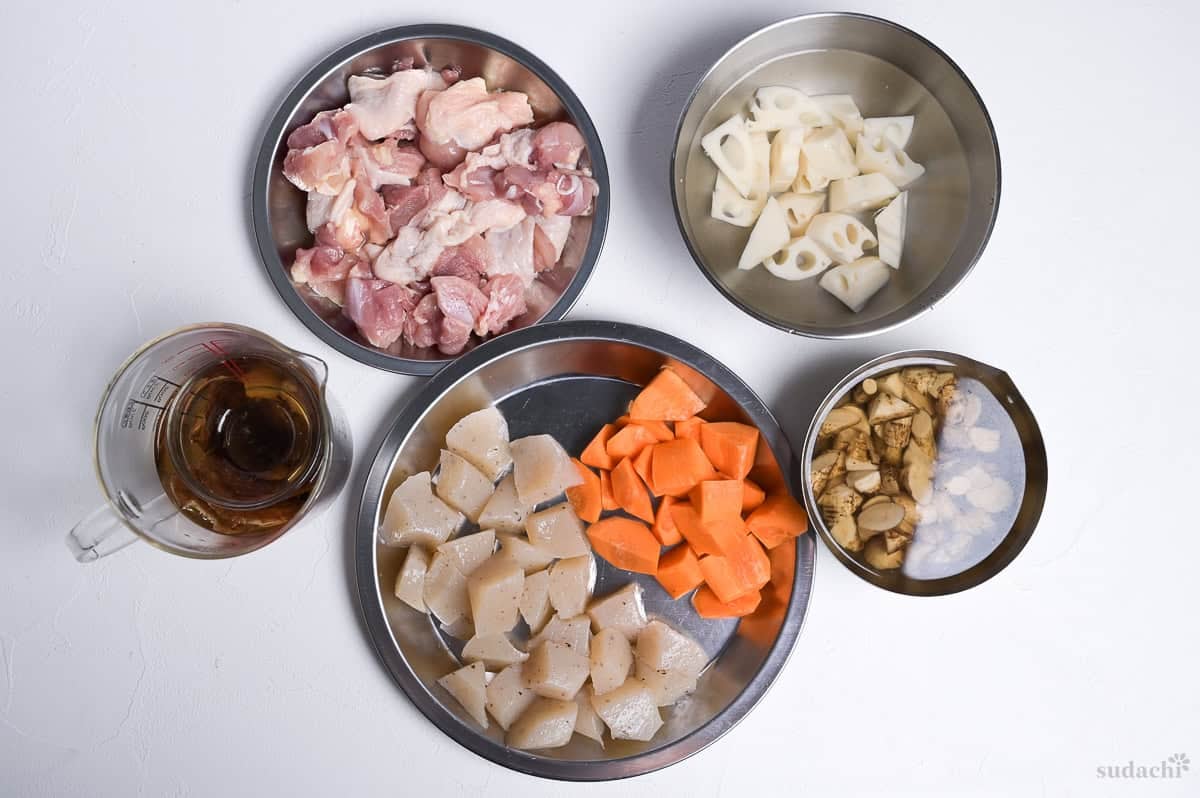 Chicken, vegetables, konnyaku and dashi mise en place prep for making chikuzenni