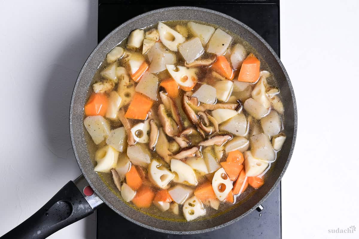 chikuzenni simmering in a wide pan on the stove top