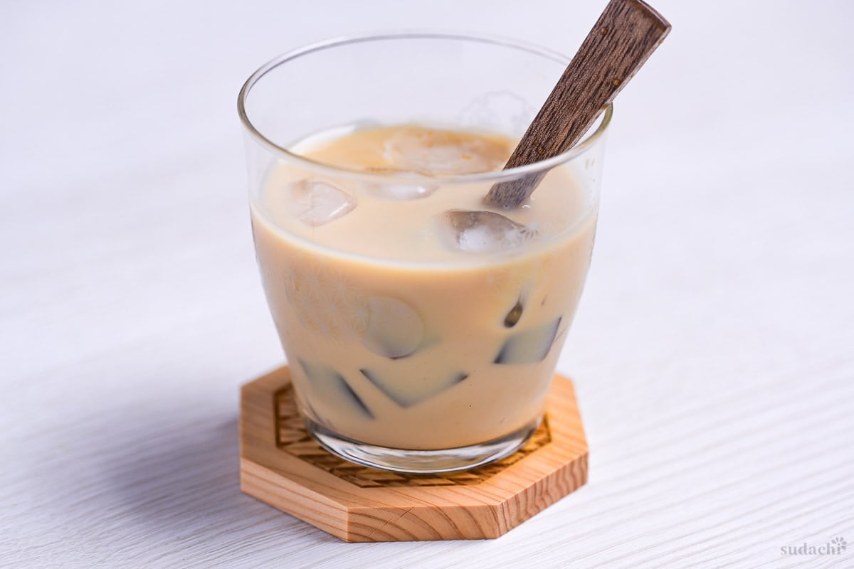 cubed coffee jelly in a small glass of iced latte
