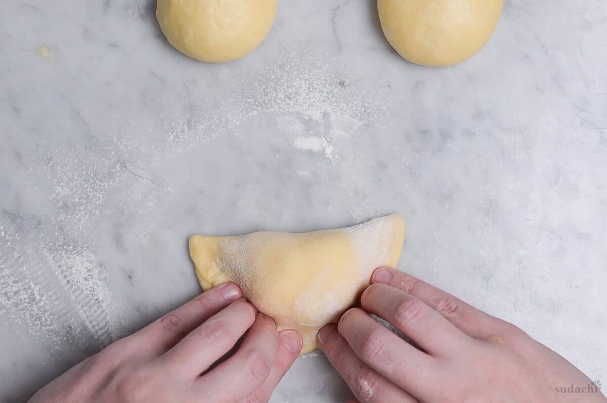 cream pan dough pulled over pastry cream filling and pressed to seal