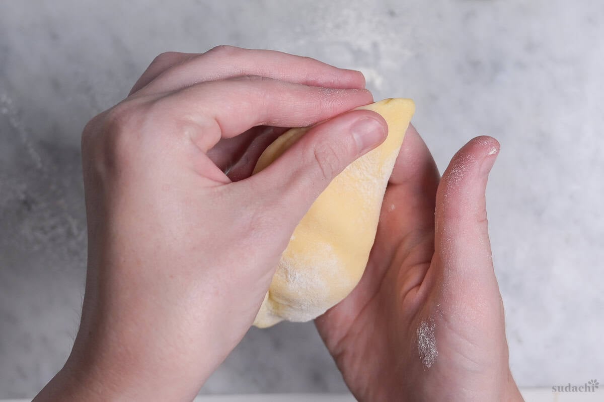 pinching dough seam to secure