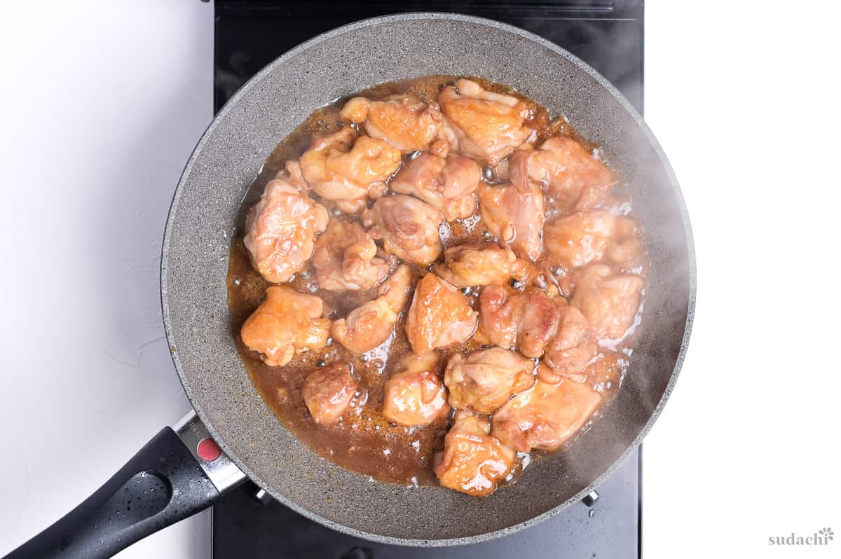 teriyaki chicken in a pan on the stove top