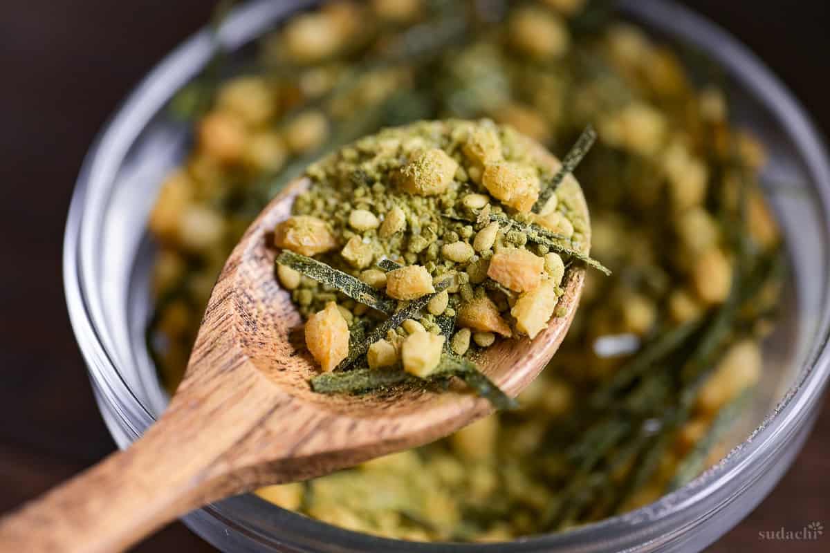 Homemade instant ochazuke scooped onto a wooden spoon close up
