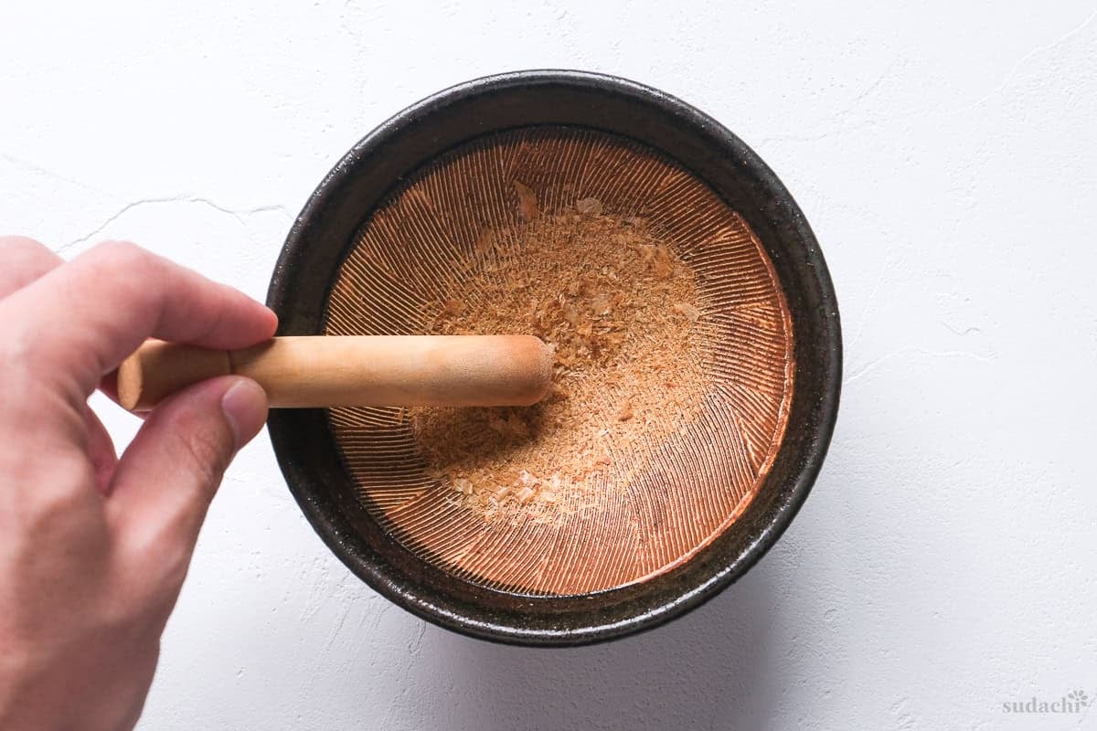 grinding bonito flakes with Japanese suribachi (mortar and pestle)