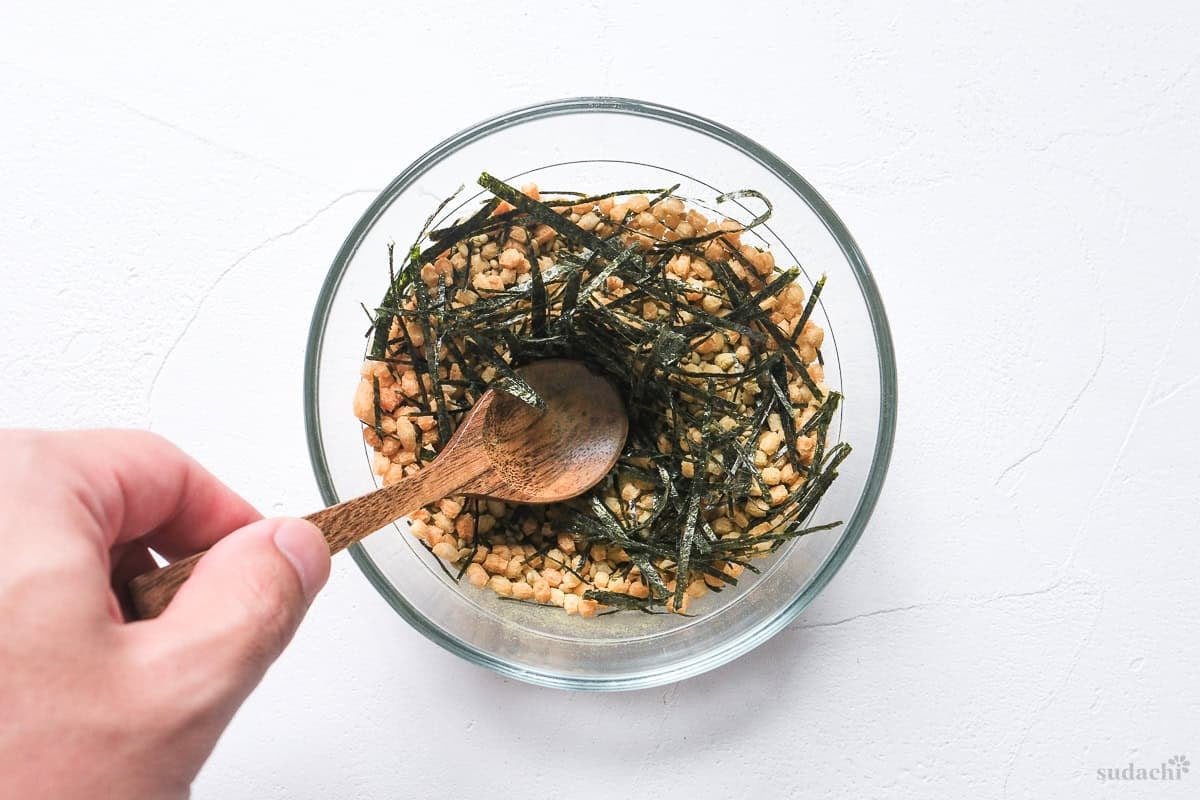 homemade instant ochazuke ingredients in a bowl with arare (rice crackers) and kizami (shredded) nori