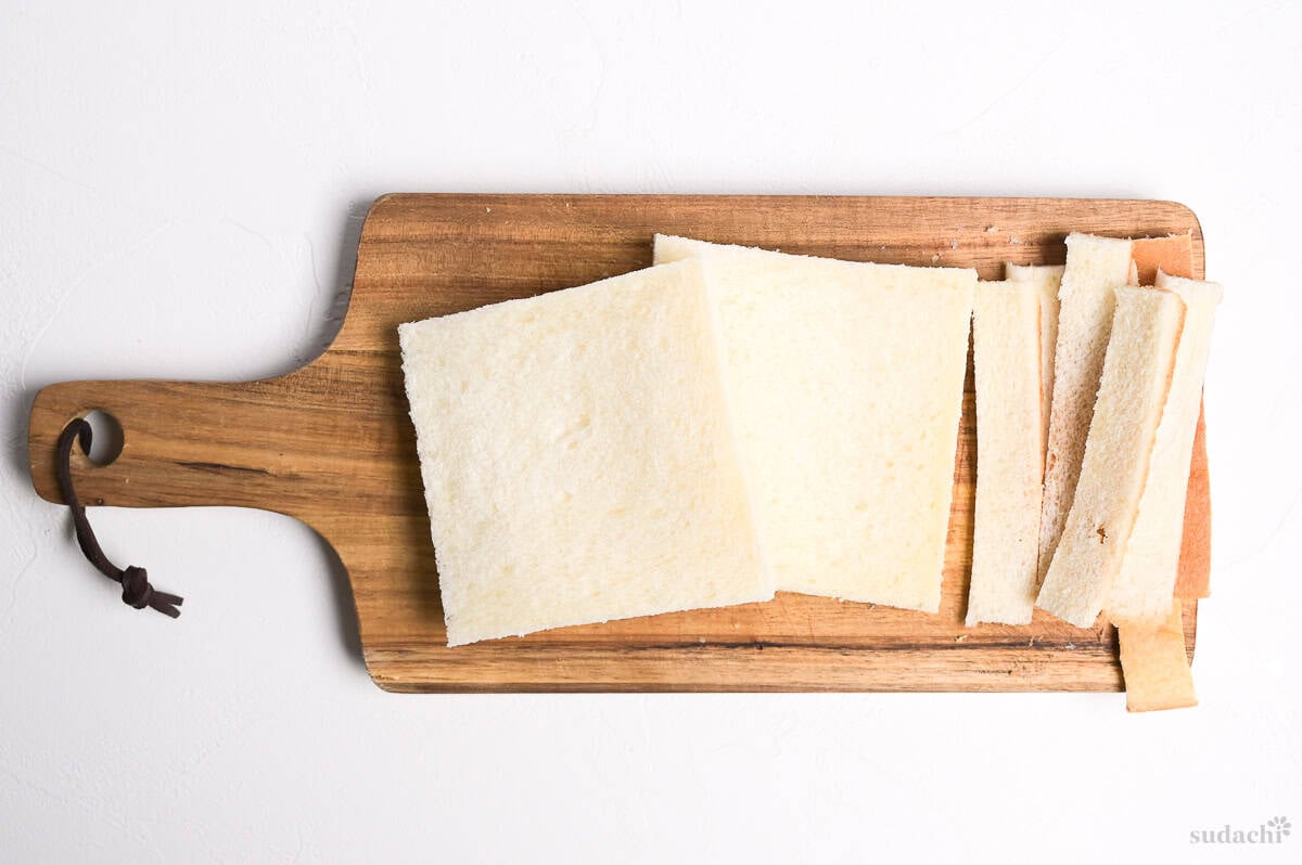 crusts cut off of two slices of sandwich bread