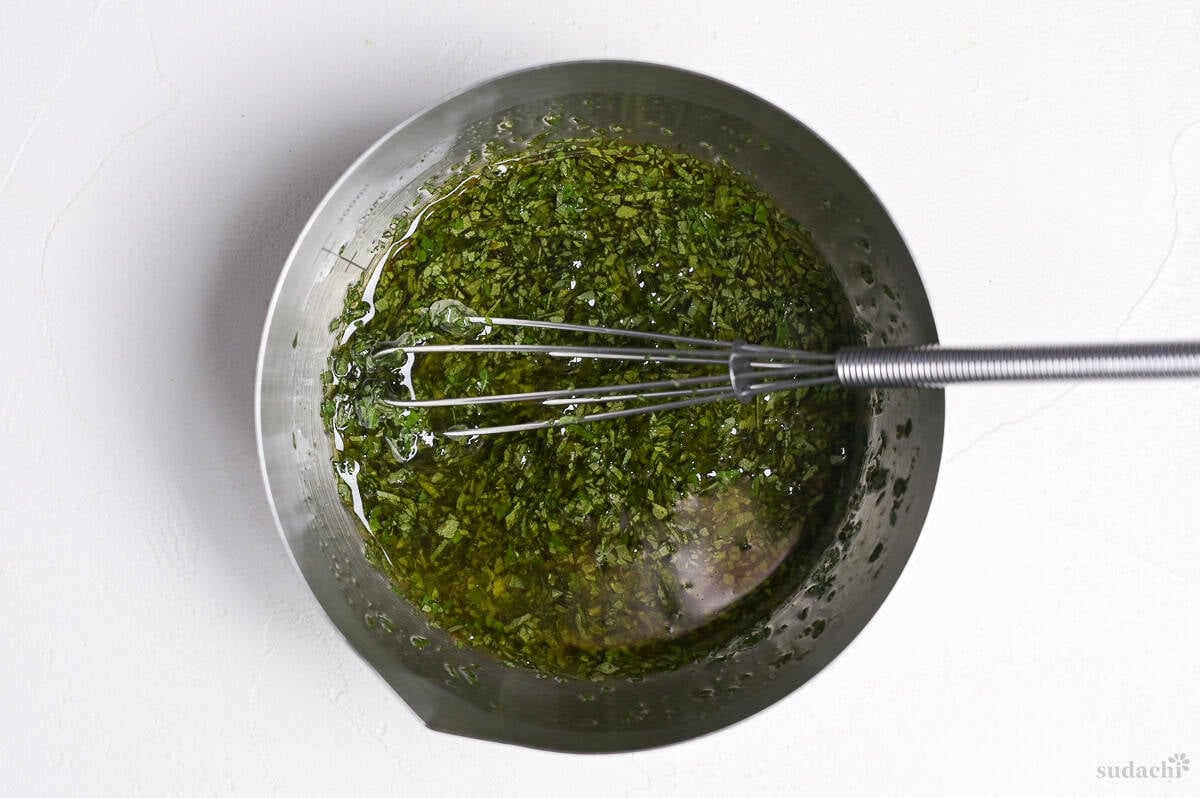 Shiso dressing in a small steel mixing bowl with metal whisk
