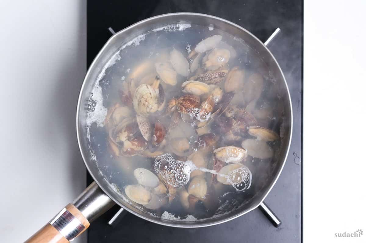 steamed clams added back to broth in a saucepan to make asari miso soup