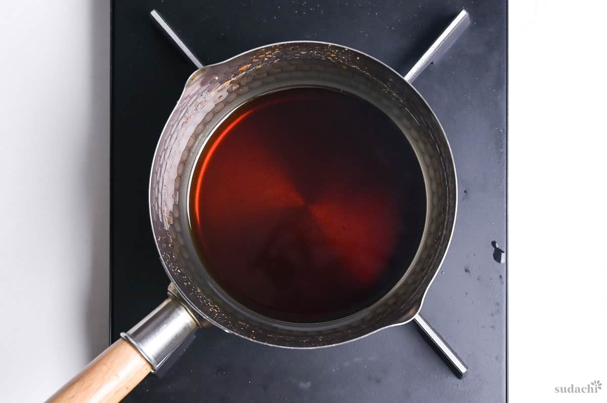 broth for kamo nanban soba in a saucepan on the stove top