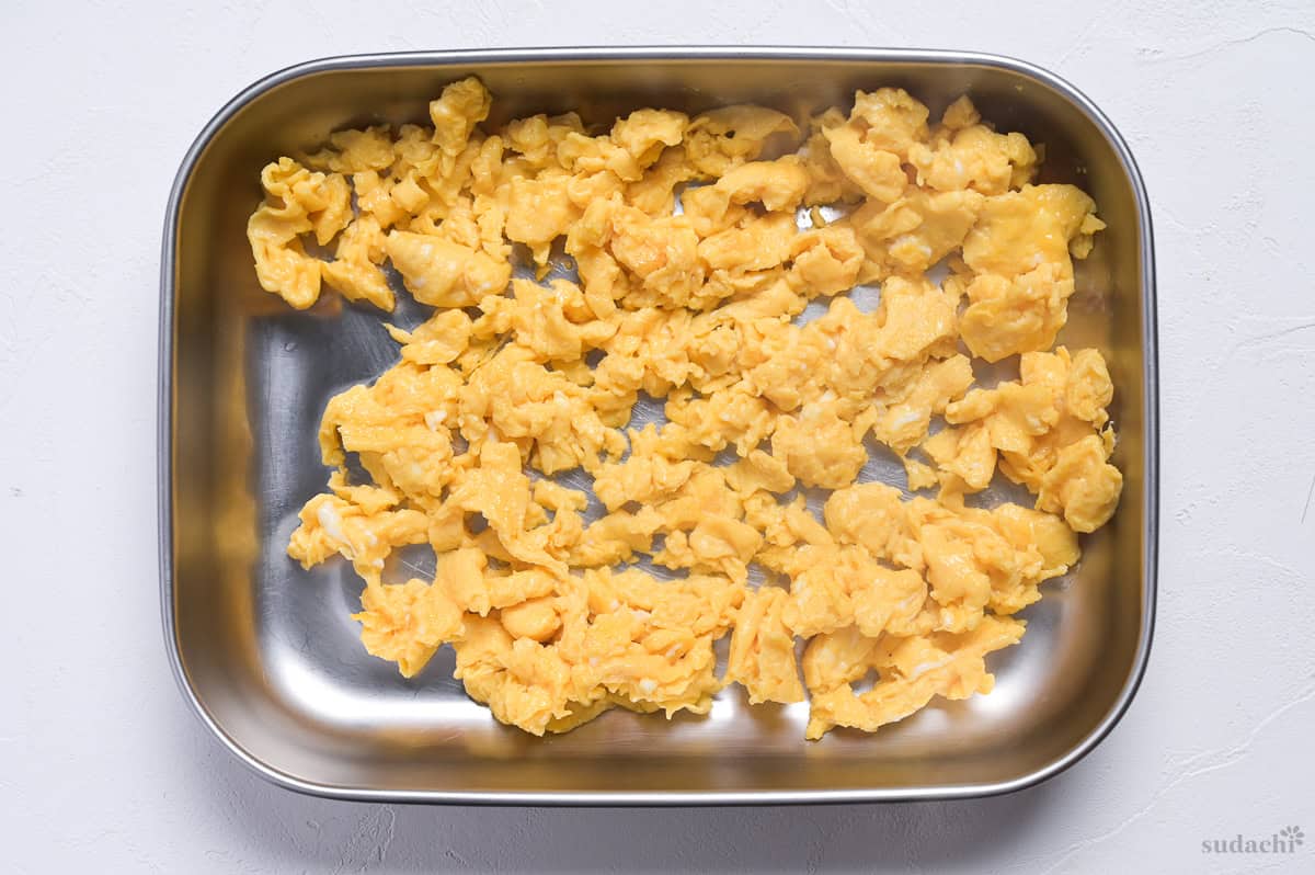 scrambled egg in a steel container.