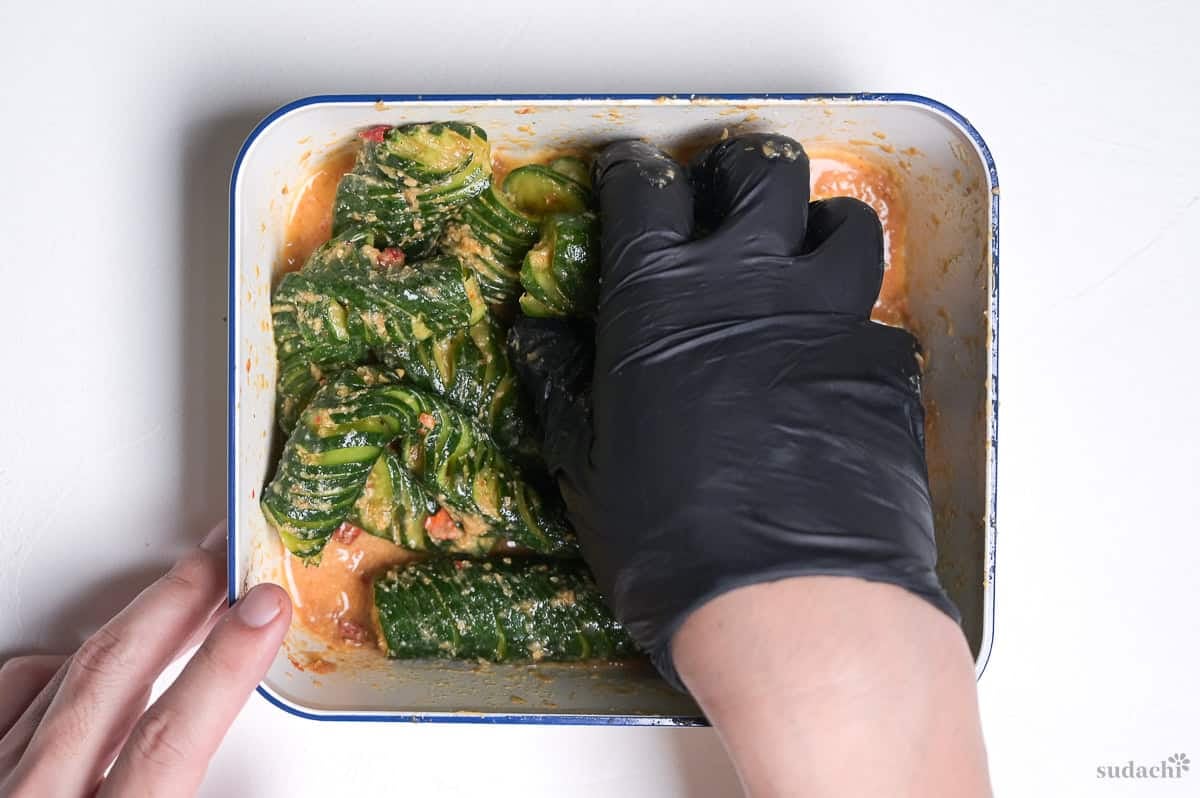 spicy miso accordion cucumbers in a container